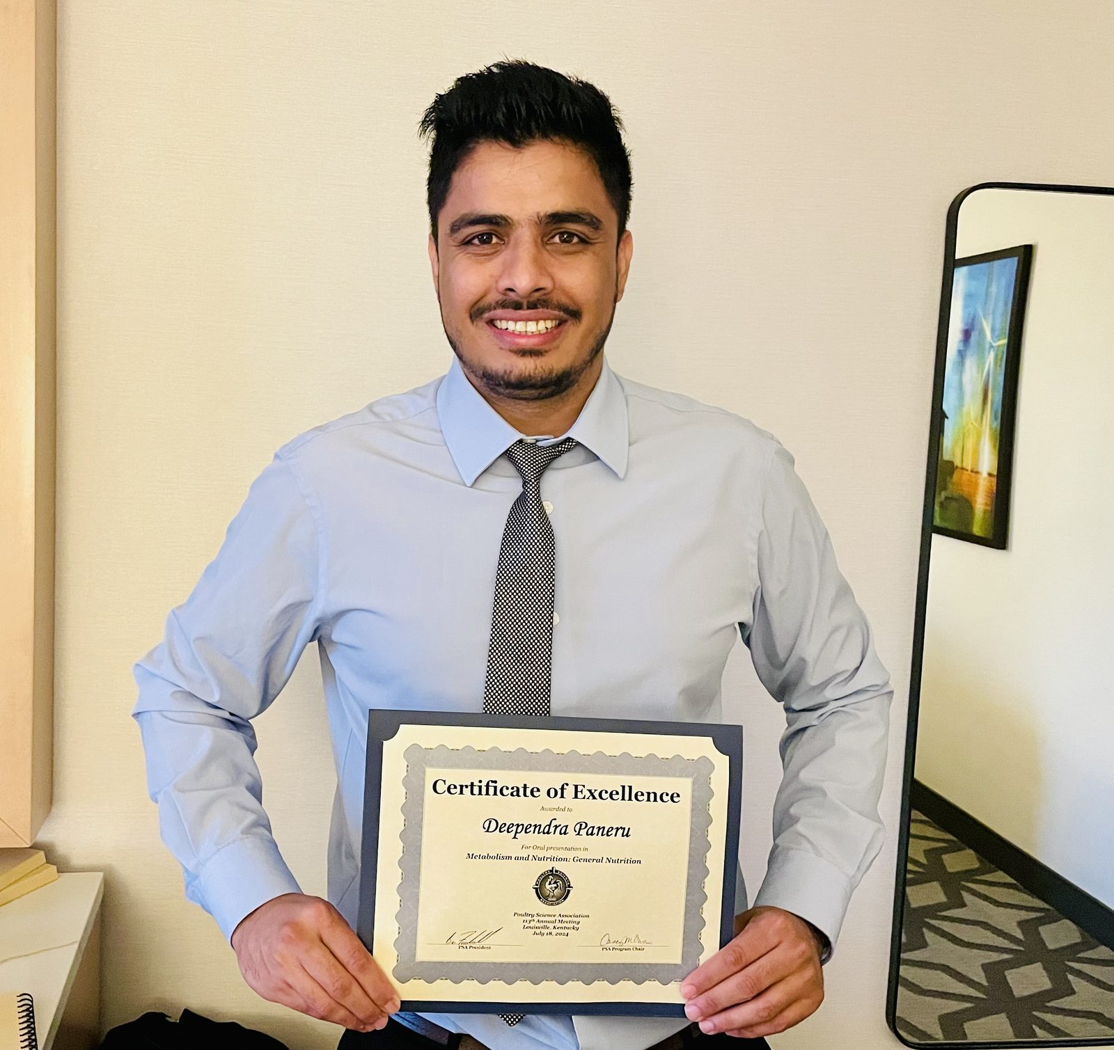 Deependra Paneru with a Poultry Science Association Certificate of Excellence