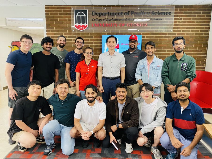 Kim Lab group at the UGA Department of Poultry Science sign